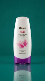 Bottle of Longrich SOD Sheep Placenta Skin Milk on a teal background