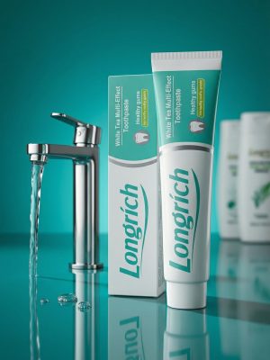 Longrich toothpaste tube and packaging on a reflective surface with a teal background