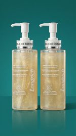Two bottles of Laundich product on a teal background